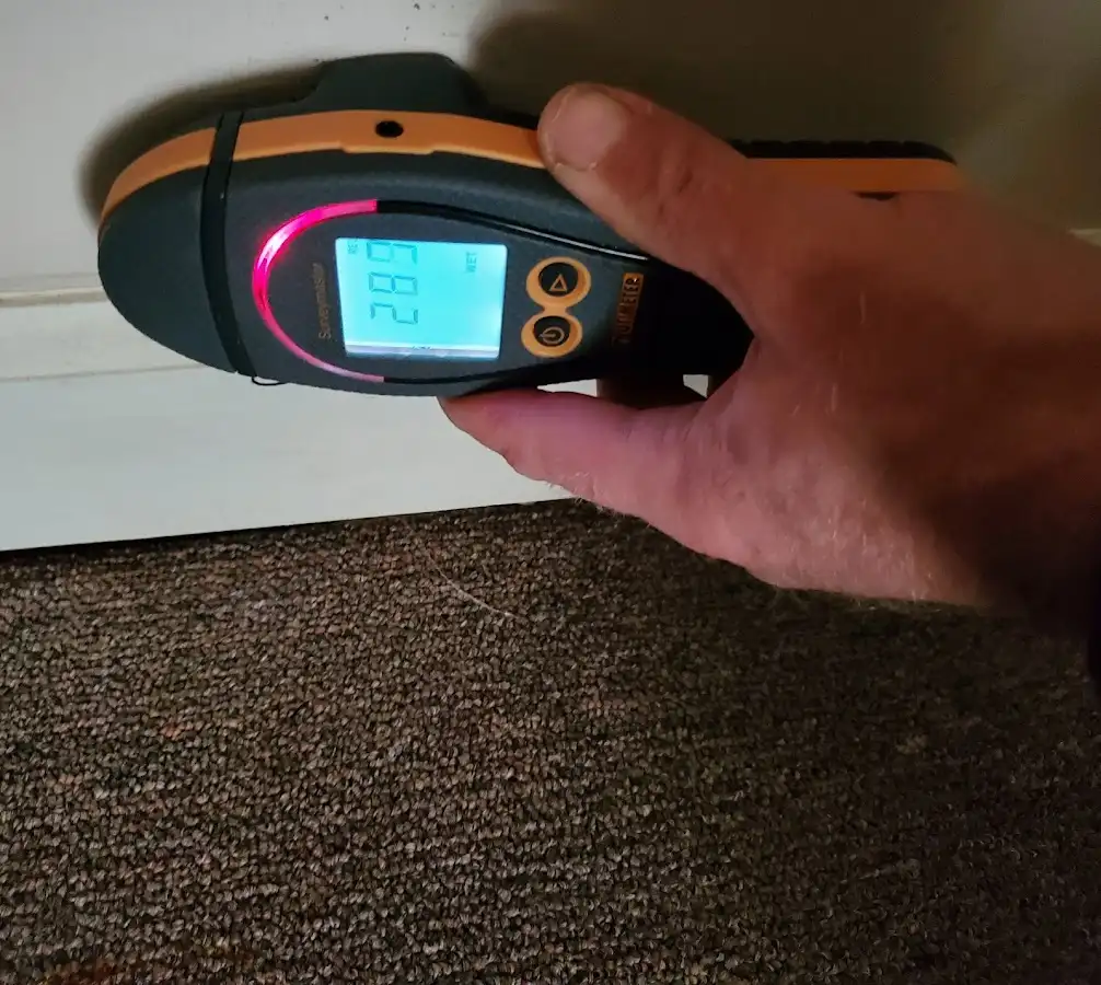Moisture detection at baseboard during Storm Damage Restoration in Lincolnshire